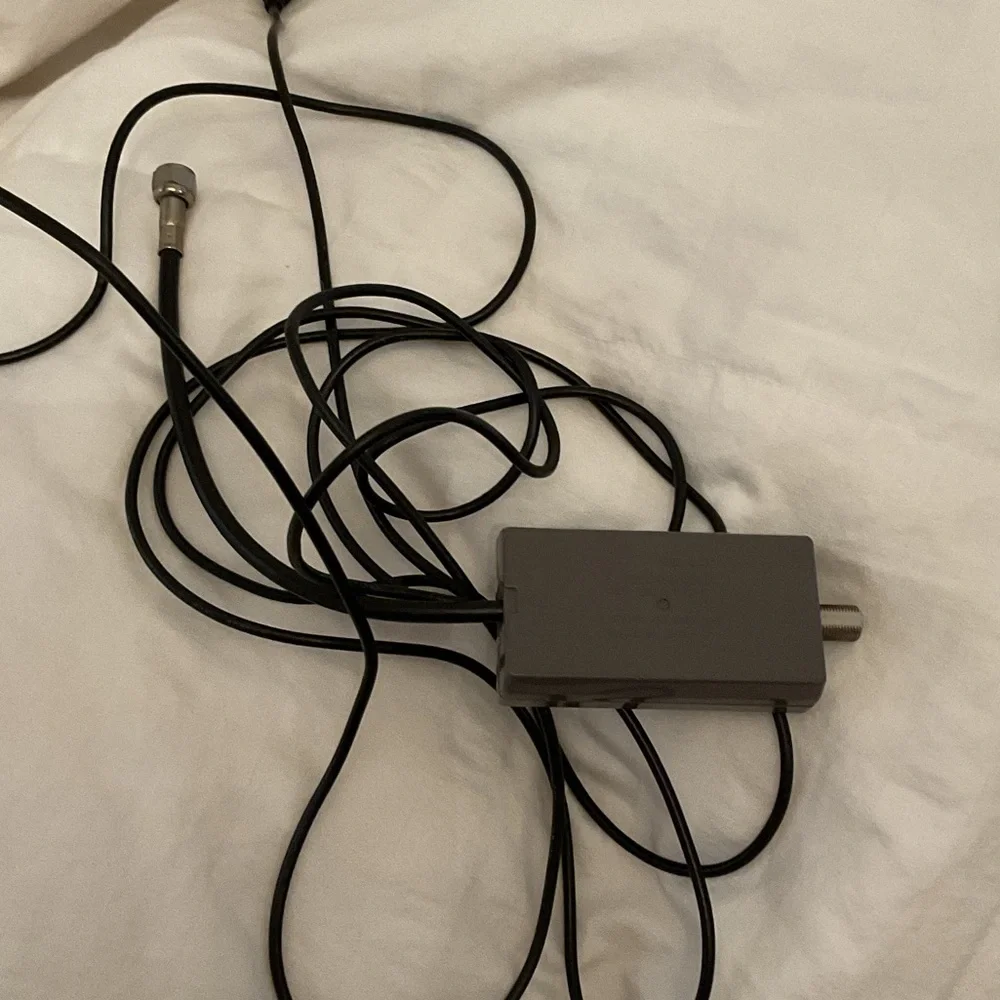 Nintendo Console in Gray and Black with controllers and gun and cords